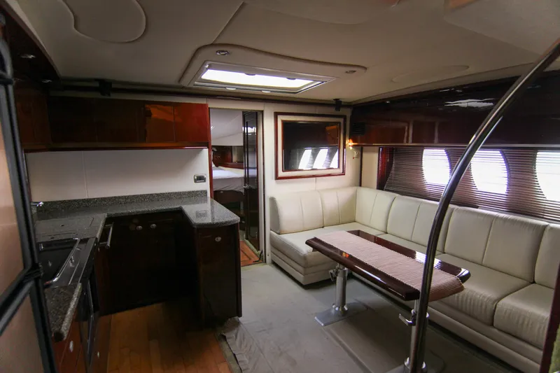  Yacht Photos Pics Luxurious interior of 2008 Sea Ray 48 Sundancer yacht with modern kitchen and seating area.