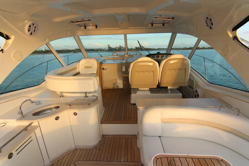  Yacht Photos Pics Luxurious interior of 2008 Sea Ray 48 Sundancer yacht with elegant seating and wood flooring.