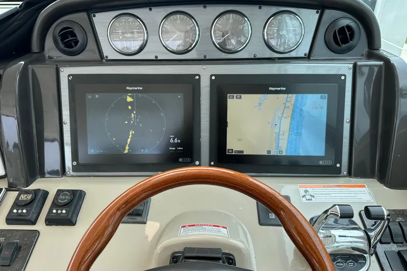  Yacht Photos Pics Dashboard of 2008 Sea Ray 48 Sundancer with Raymarine navigation displays and controls.