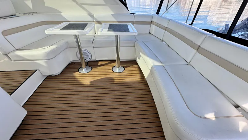  Yacht Photos Pics 2009 Sea Ray 43 Sundancer interior with white seating and wooden flooring.