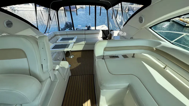  Yacht Photos Pics Luxurious interior of 2009 Sea Ray 43 Sundancer yacht with elegant seating and scenic marina view.
