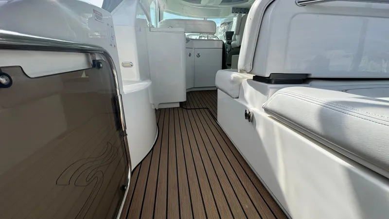  Yacht Photos Pics 2009 Sea Ray 43 Sundancer interior with sleek seating and wood-patterned flooring.