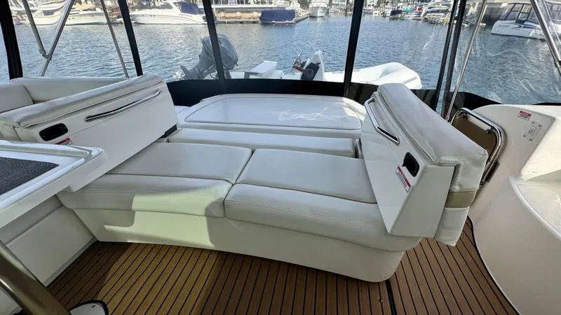  Yacht Photos Pics 2009 Sea Ray 43 Sundancer yacht interior with white seating and teak flooring.