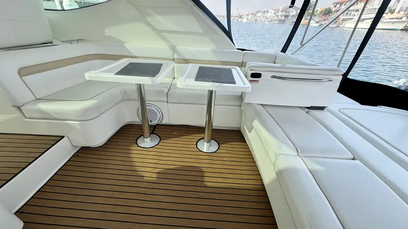  Yacht Photos Pics 2009 Sea Ray 43 Sundancer interior with white seating and wooden flooring.