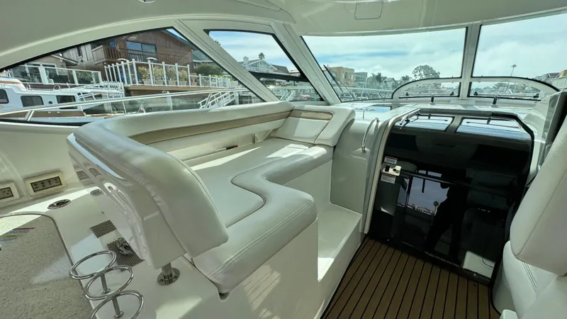  Yacht Photos Pics 2009 Sea Ray 43 Sundancer interior with white seating and panoramic windows.