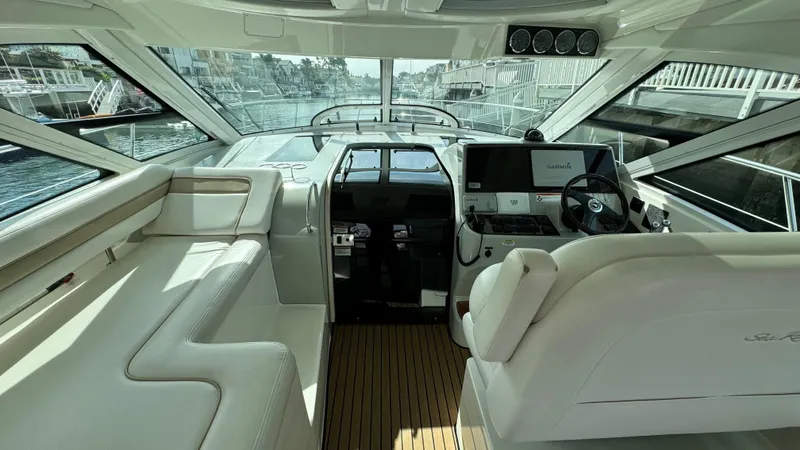 Yacht Photos Pics Interior of 2009 Sea Ray 43 Sundancer yacht with modern helm and seating.