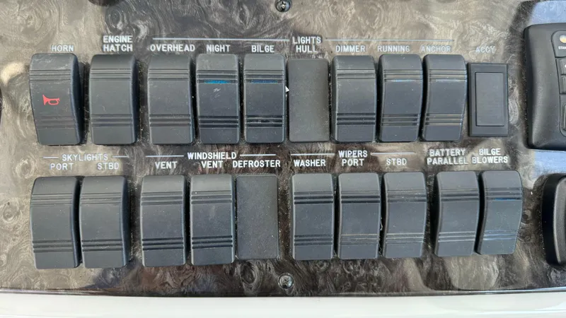  Yacht Photos Pics Control panel of a 2009 Sea Ray 43 Sundancer boat with labeled switches.