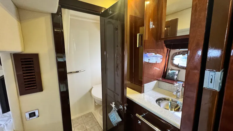  Yacht Photos Pics Luxurious bathroom interior of 2009 Sea Ray 43 Sundancer yacht with modern fixtures.