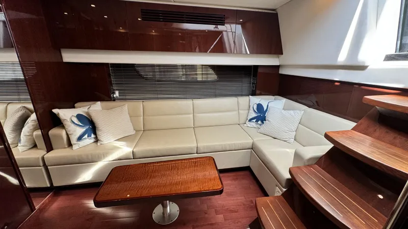  Yacht Photos Pics Luxurious interior of 2009 Sea Ray 43 Sundancer yacht with elegant seating and wooden accents.