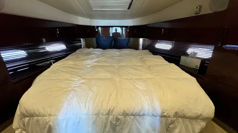  Yacht Photos Pics Luxurious bedroom interior of 2009 Sea Ray 43 Sundancer yacht with plush bedding.