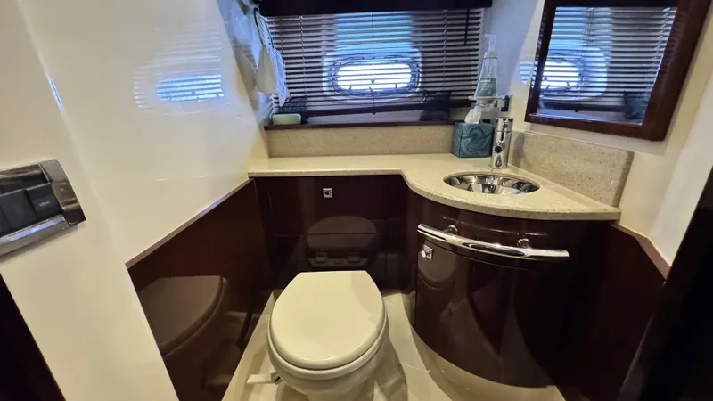  Yacht Photos Pics Luxurious bathroom in 2009 Sea Ray 43 Sundancer yacht with modern fixtures and elegant design.