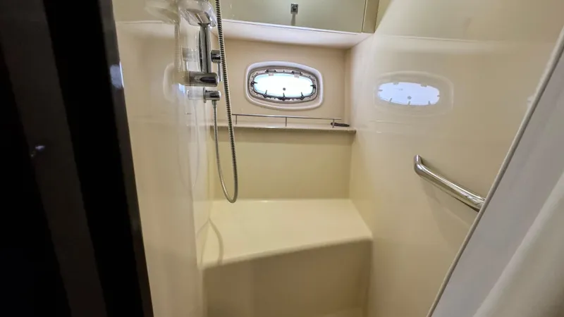  Yacht Photos Pics Shower area in 2009 Sea Ray 43 Sundancer yacht with window and handrail.