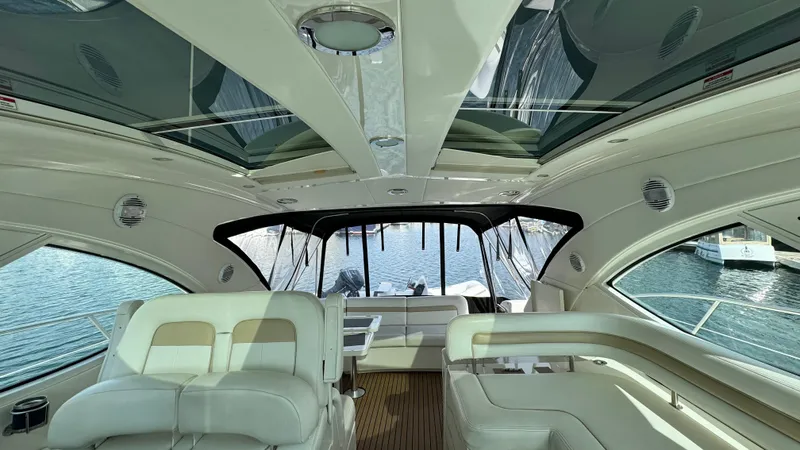  Yacht Photos Pics Luxurious interior of a 2009 Sea Ray 43 Sundancer yacht with panoramic windows.