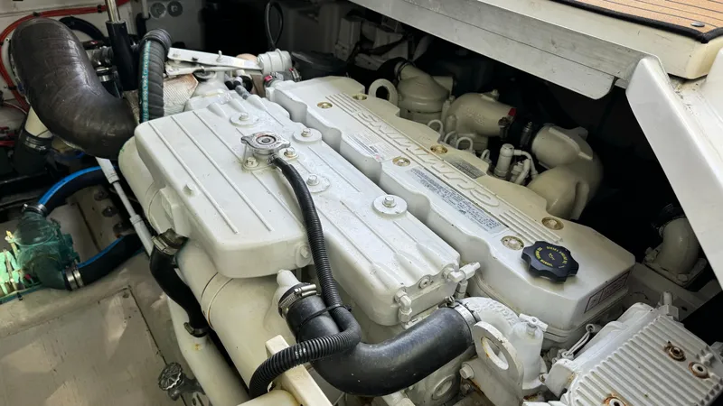  Yacht Photos Pics Engine compartment of a 2009 Sea Ray 43 Sundancer boat, showcasing mechanical components.