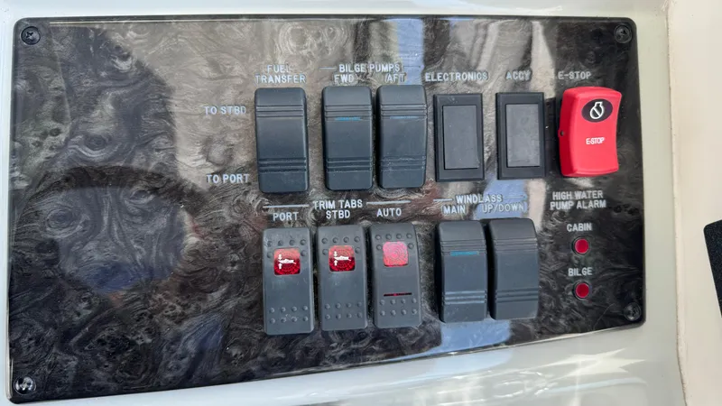  Yacht Photos Pics Control panel of a 2009 Sea Ray 43 Sundancer boat with various switches and indicators.