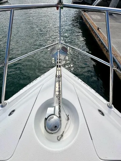Visionary 21 Yacht Photos Pics Bow of 2006 Doral Elegante boat with anchor, docked at marina.