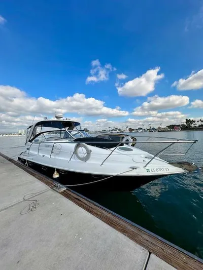 Visionary 21 Yacht Photos Pics 2006 Doral Elegante boat docked by the waterfront under a blue sky.