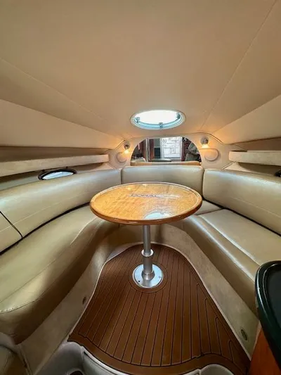 Visionary 21 Yacht Photos Pics 2006 Doral Elegante boat interior with round table and leather seating.