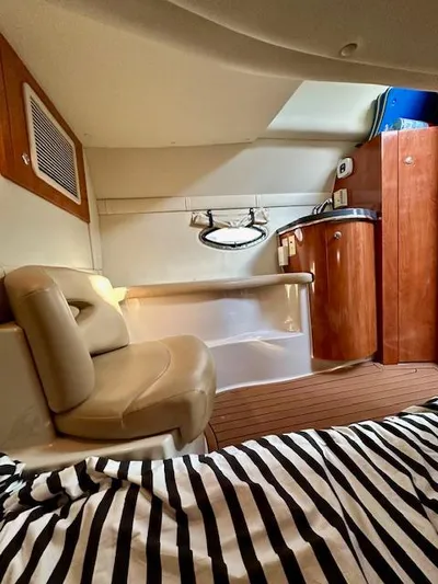 Visionary 21 Yacht Photos Pics Interior of a 2006 Doral Elegante boat with seating and wooden cabinetry.