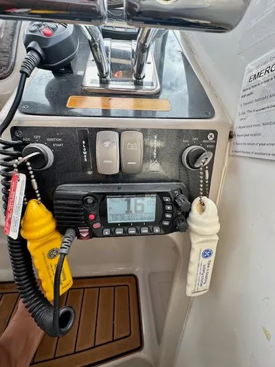 Visionary 21 Yacht Photos Pics Control panel of a 2006 Doral Elegante boat with radio and emergency equipment.