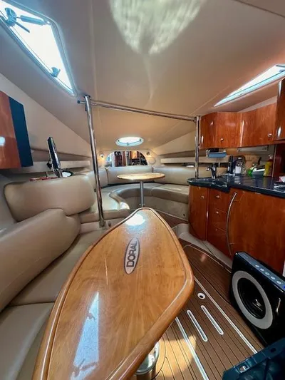 Visionary 21 Yacht Photos Pics Interior of a 2006 Doral Elegante yacht with luxurious seating and wooden finishes.