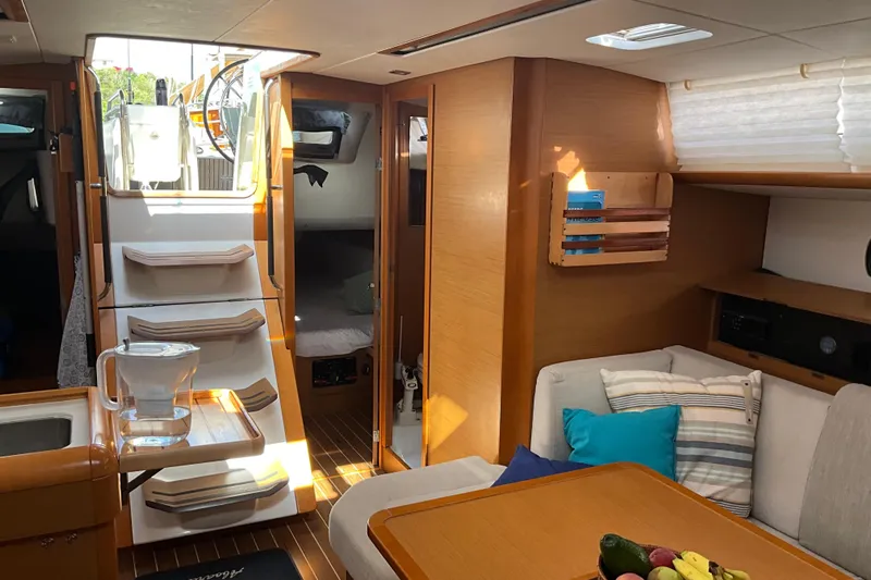 Epicurios Yacht Photos Pics Interior of 2015 Jeanneau Sun Odyssey 469 yacht, featuring cozy seating and modern design.