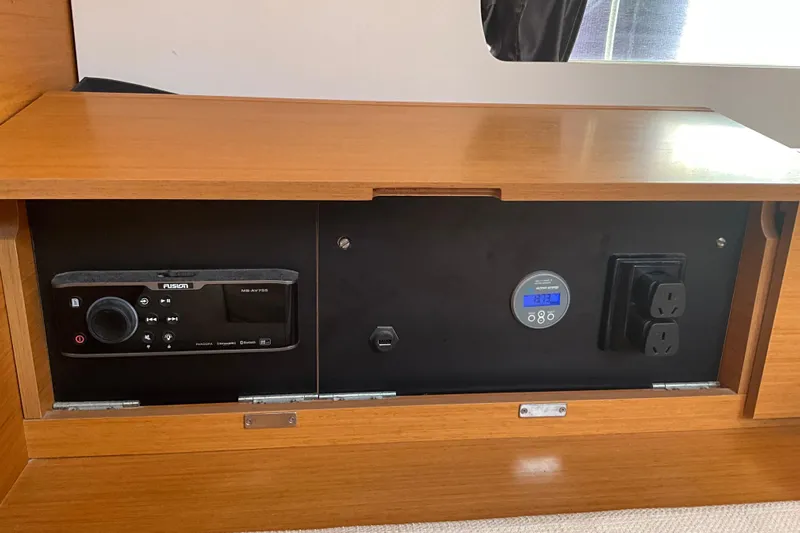 Epicurios Yacht Photos Pics Control panel inside 2015 Jeanneau Sun Odyssey 469 yacht with audio system and power outlets.