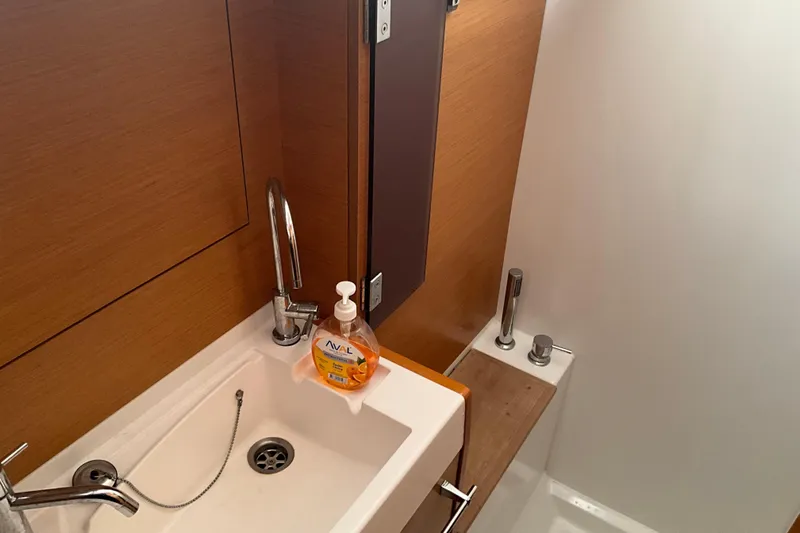 Epicurios Yacht Photos Pics Bathroom sink area on 2015 Jeanneau Sun Odyssey 469 yacht, featuring modern fixtures.