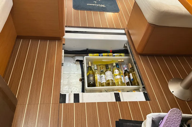 Epicurios Yacht Photos Pics Hidden wine storage in 2015 Jeanneau Sun Odyssey 469 yacht interior.