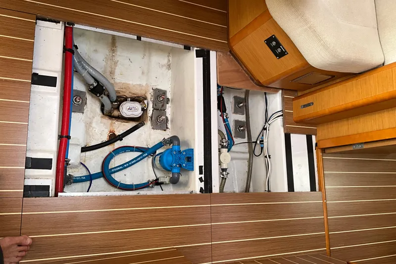 Epicurios Yacht Photos Pics Interior view of 2015 Jeanneau Sun Odyssey 469 yacht, showcasing underfloor plumbing and wiring.