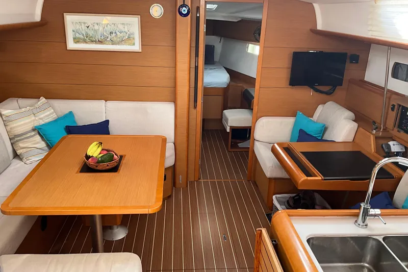 Epicurios Yacht Photos Pics Interior of 2015 Jeanneau Sun Odyssey 469 yacht with cozy seating and modern amenities.