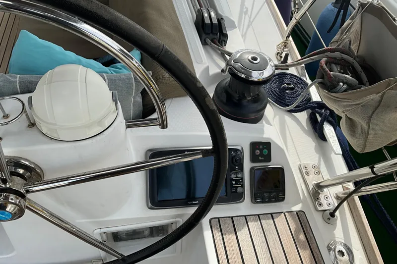 Epicurios Yacht Photos Pics Cockpit of 2015 Jeanneau Sun Odyssey 469 sailboat with steering wheel and navigation instruments.