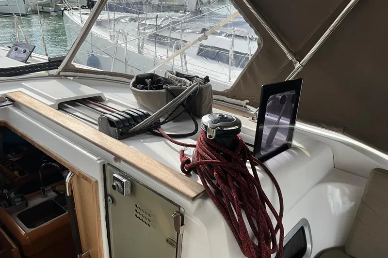 Epicurios Yacht Photos Pics 2015 Jeanneau Sun Odyssey 469 yacht cockpit with ropes and winch, docked at marina.