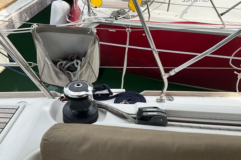 Epicurios Yacht Photos Pics 2015 Jeanneau Sun Odyssey 469 sailboat deck with winch and ropes in marina.