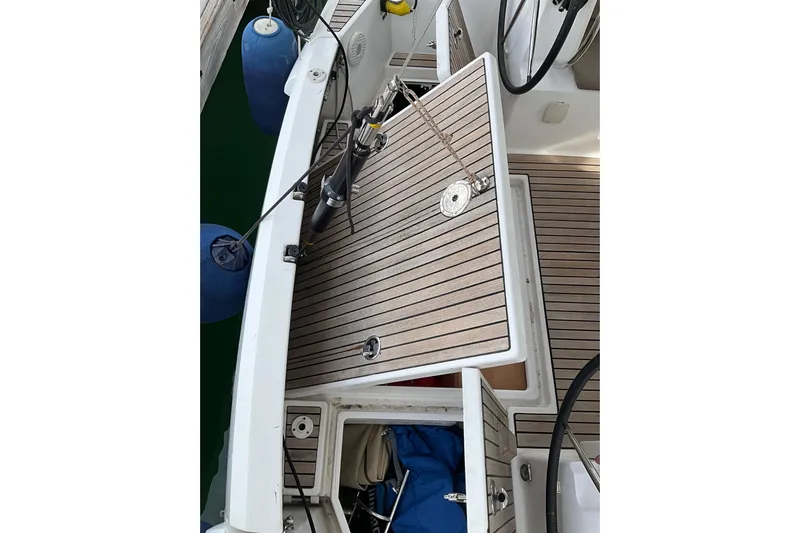 Epicurios Yacht Photos Pics 2015 Jeanneau Sun Odyssey 469 yacht deck with wooden finish and storage compartments.