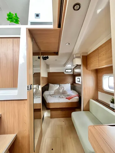 Tropicat Yacht Photos Pics 2024 Bali Catspace 40 interior with cozy bedroom, wooden finishes, and modern design.