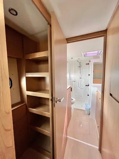 Tropicat Yacht Photos Pics 2024 Bali Catspace 40 interior with wooden shelves and modern bathroom.