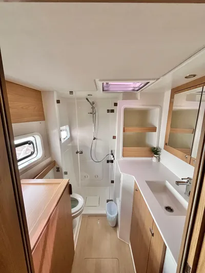 Tropicat Yacht Photos Pics 2024 Bali Catspace 40 bathroom with modern fixtures, shower, and wooden cabinetry.
