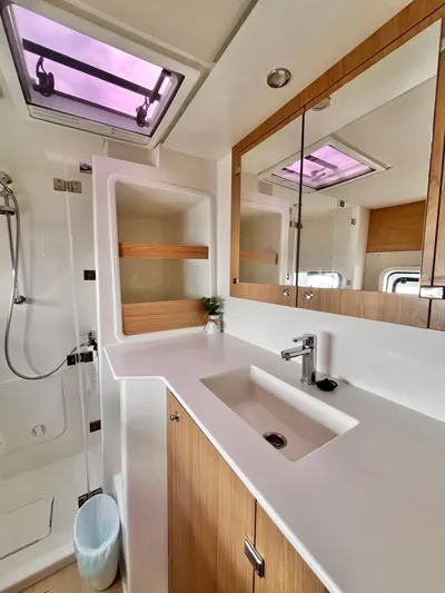 Tropicat Yacht Photos Pics 2024 Bali Catspace 40 bathroom with modern fixtures and skylight.