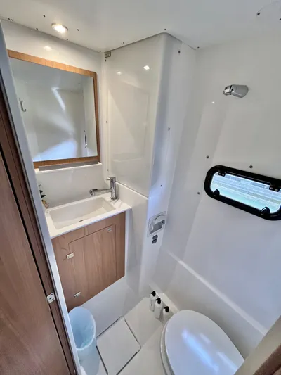 Tropicat Yacht Photos Pics 2024 Bali Catspace 40 bathroom with modern fixtures, mirror, and compact design.