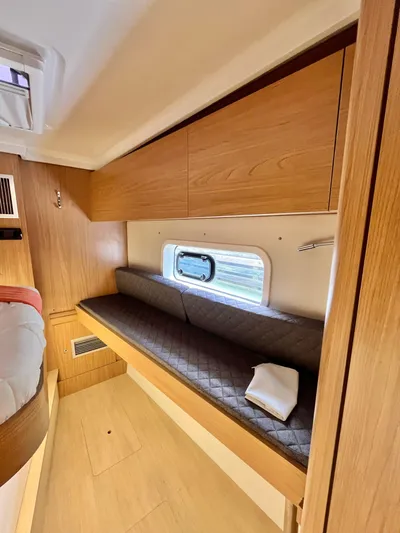 Tropicat Yacht Photos Pics Interior of 2024 Bali Catspace 40 with wooden cabinetry and cushioned seating.