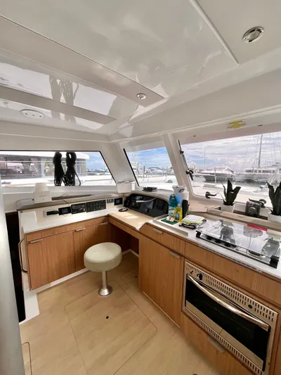 Tropicat Yacht Photos Pics Interior of 2024 Bali Catspace 40 yacht with modern kitchen and panoramic windows.