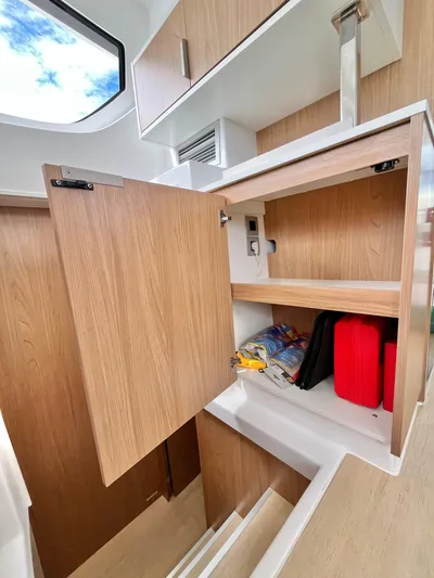 Tropicat Yacht Photos Pics 2024 Bali Catspace 40 interior with open wooden cabinets and modern design.