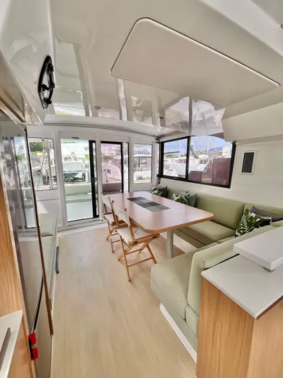 Tropicat Yacht Photos Pics 2024 Bali Catspace 40 interior with modern dining area and panoramic windows.
