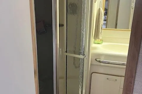 To Come Yacht Photos Pics 1992 Sea Ray Sundancer bathroom with shower and sink.