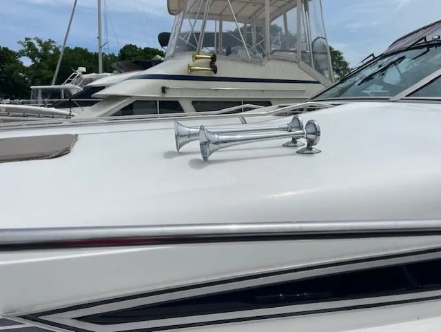 To Come Yacht Photos Pics 1992 Sea Ray Sundancer boat with chrome horns docked at marina.