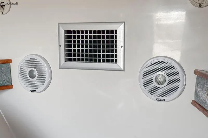 Jesse Girl Yacht Photos Pics 2005 Carolina Classic 28 boat interior with speakers and ventilation grille.