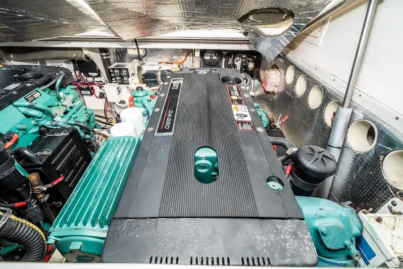 Jesse Girl Yacht Photos Pics Engine room of a 2005 Carolina Classic 28 boat, showcasing detailed mechanical components.