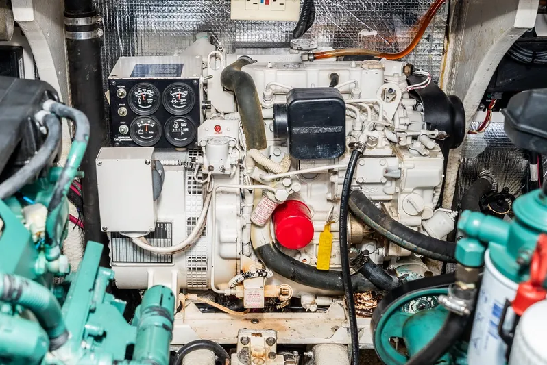 Jesse Girl Yacht Photos Pics Engine room of a 2005 Carolina Classic 28 boat, featuring detailed mechanical components.