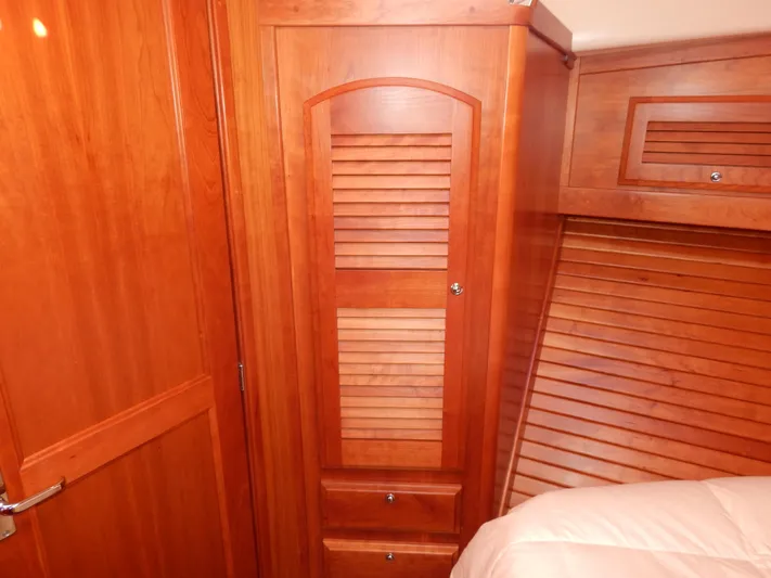  Yacht Photos Pics 2010 Sabre 40 Sedan interior with wooden cabinetry and louvered doors.